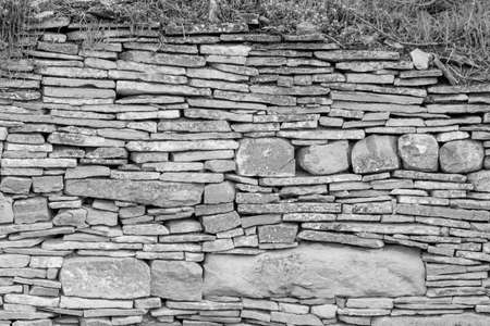 image of stone wall in rural environment, black and white imageの写真素材