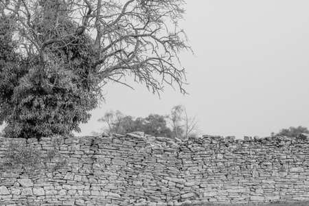 image of stone wall in rural environment, black and white imageの写真素材