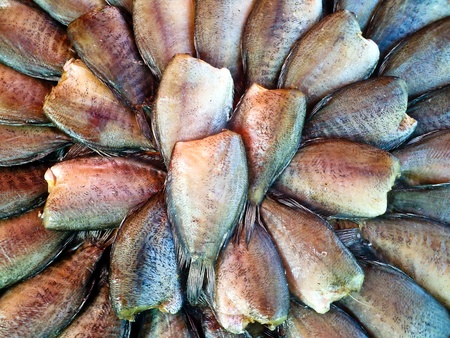 Dried fishes with salt on the stall sold beside a road across provinces.の写真素材
