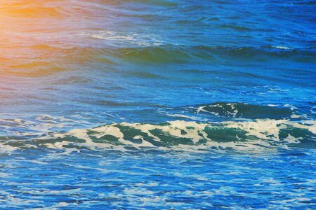 Abstract clean sea background, view on ripple foam surface of water. Deep turquoise blue ocean...