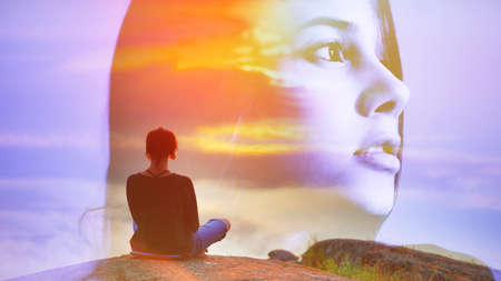 Abstract double multiply exposure girl head portrait outdoors on nature, Beautiful woman sits back in a pose of a lotus practice air yoga meditation, amazing top view lake sunset.の写真素材