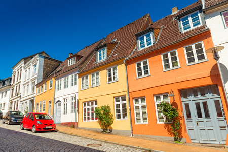 Empty street of a small European town. Colored historical houses in the traditional german-danish...