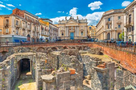 Catania - April 2019, Sicily, Italy: The Ruins of an ancient Roman theater and The Church of San Biagio (Chiesa San Biagio in Sant'Agata alla Fornace)のeditorial素材