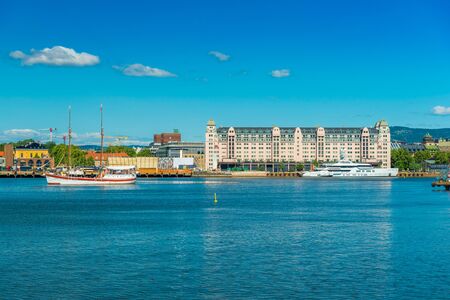 Cityscape of Oslo viewed from the sea, Norway. Skyline of a port city on summer sunny dayの写真素材