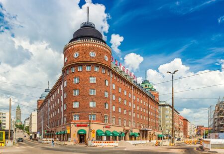 Helsinki - June 2019, Finland: View of a triangle building built of red brick in the traditional Scandinavian architecture style. Oxygenol company buildingのeditorial素材