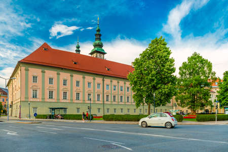 Klagenfurt - June 2020, Austria: A white car drives near the Landhaus (Country House) building in the Austrian city of Klagenfurtのeditorial素材
