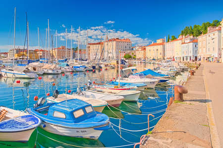 Piran - June 2020, Slovenia: Colorful boats lying on the water in the harbor of the ancient Slovenian town of Piranのeditorial素材