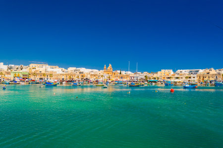 Cityscape of Marsaxlokk, a small coastal town in Maltaの写真素材