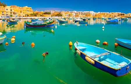 View of the small town of Birzebbuga with fishing boats lying on the water, Maltaの写真素材