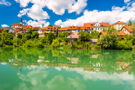 Cityscape of Novo Mesto mirrored in Krka river, Sloveniaの写真素材