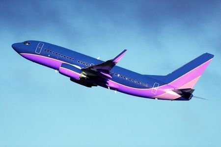 A passenger plane taking off into the clouds