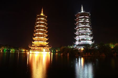 Night shot of Pagodas representing the Sun and the Moon in Guilin, Chinaの写真素材