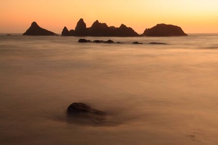 Spires jutting from the sea at dusk in Central Oregonの写真素材