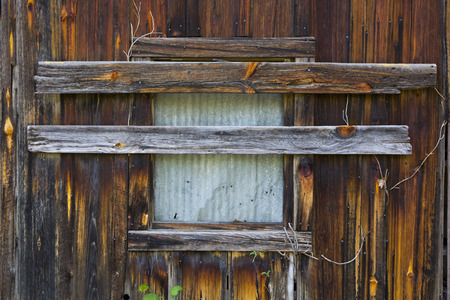A boarded up window on an old building in the ghost town of Rush, Arkansasの写真素材