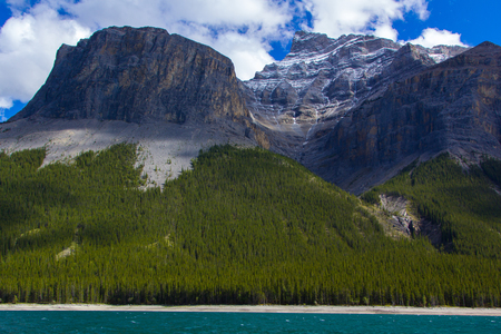 Beautiful mountains on the shore of Lake Minnewanka, Banff National Park, Alberta, Canadaの写真素材