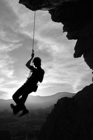 silhouette of a climber in mountainsの写真素材