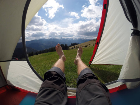 Legs sticking out of a tentの写真素材