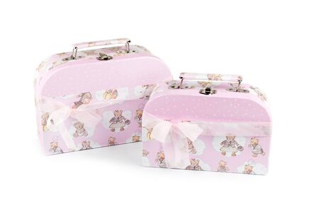Two pink suitcase on a white backgroundの写真素材