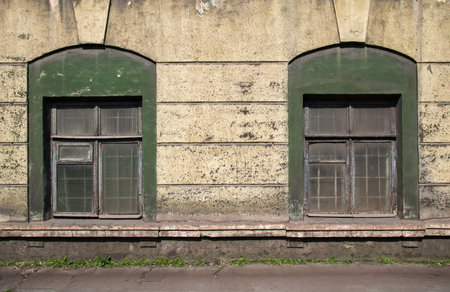two old damaged windowsの写真素材