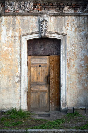 old house, wall with grunge old door, textureの写真素材