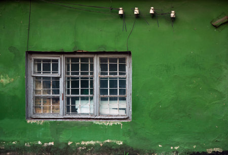 Old damaged windows, grunge window, green wall textureの写真素材