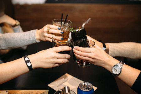 friends clink glasses