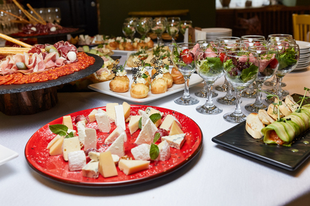 dishes on the table, salads in glasses, snacks, receptionの写真素材