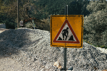 a sign that they are doing road repair workの写真素材