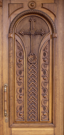warm wooden door with crossesの写真素材