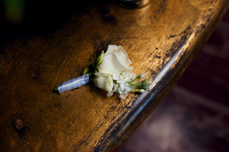 rose boutonniere on a beautiful backgroundの写真素材