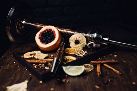 Hookah tobacco with the taste of mango, pomegranate and quince.Tobacco with the aroma of tropical fruits.Oriental smoking shishaの写真素材