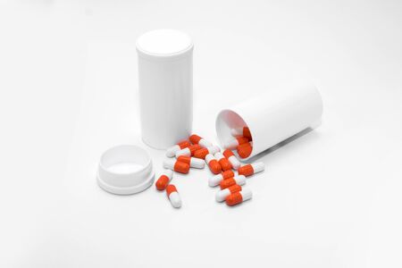 Orange Pills on a white background, medical pillsの写真素材