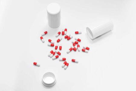 Red Pills on a white background, medical pillsの写真素材