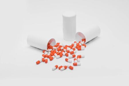 Orange Pills on a white background, medical pillsの写真素材
