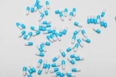 Blue Pills on a white background, medical pillsの写真素材