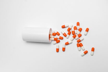 Orange Pills on a white background, medical pillsの写真素材