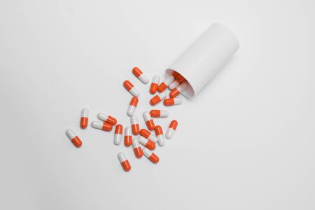 Orange Pills on a white background, medical pillsの写真素材