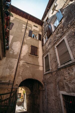 old italian house bottom view on blue sky backgroundの写真素材