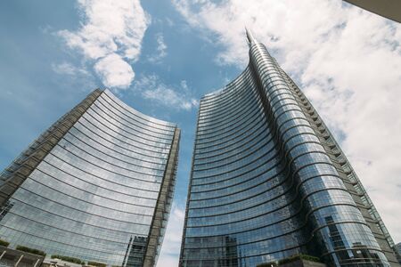 round office building on a background of blue sky with clouds
