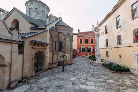 street with church and house in Prague against the skyの写真素材
