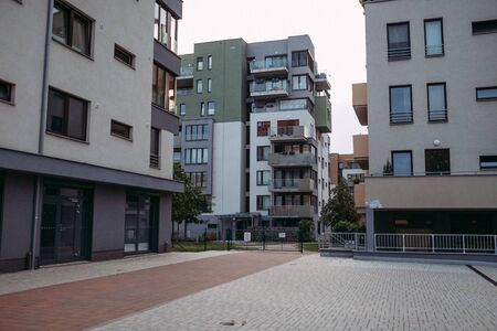modern architecture of houses in prague against a white skyの写真素材