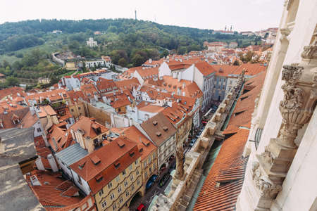 top view of orange rooftops in prague against blue skyのeditorial素材