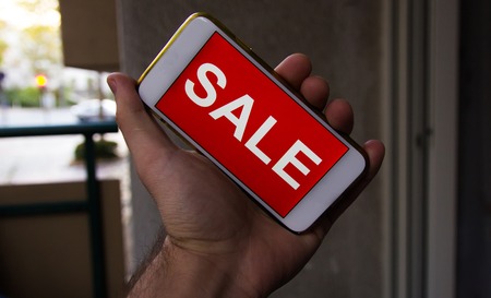 Black friday and sale inscription on smartphone screen.の写真素材