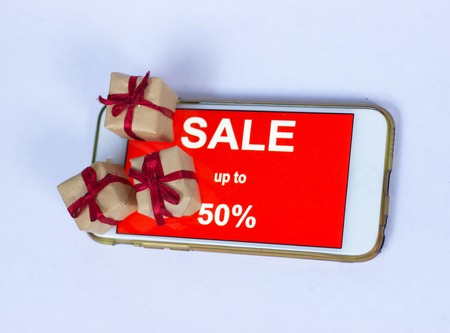 Black friday and sale inscription on smartphone screen. inscription SALES on the screen of a mobile phone.の写真素材