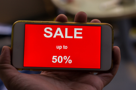 Black friday and sale inscription on smartphone screen.の写真素材