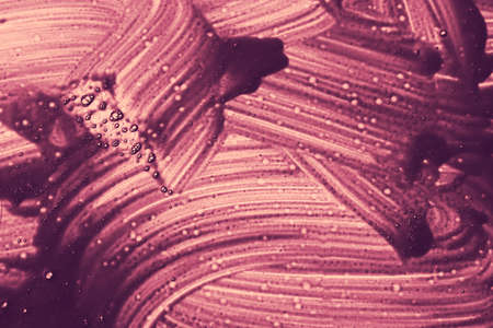 Abstract liquid background texture in purple.の写真素材