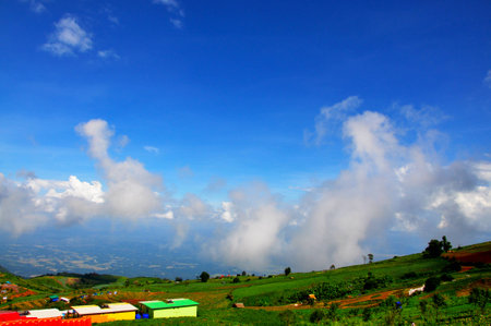 the mountain in winter with resort and blue skyの写真素材