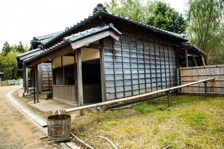 Japanese cottage with old water pipeのeditorial素材
