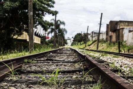 Abandoned rail line in a precarious region of a large metropolisの写真素材
