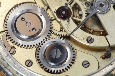 old clockwork inside view with gear wheel